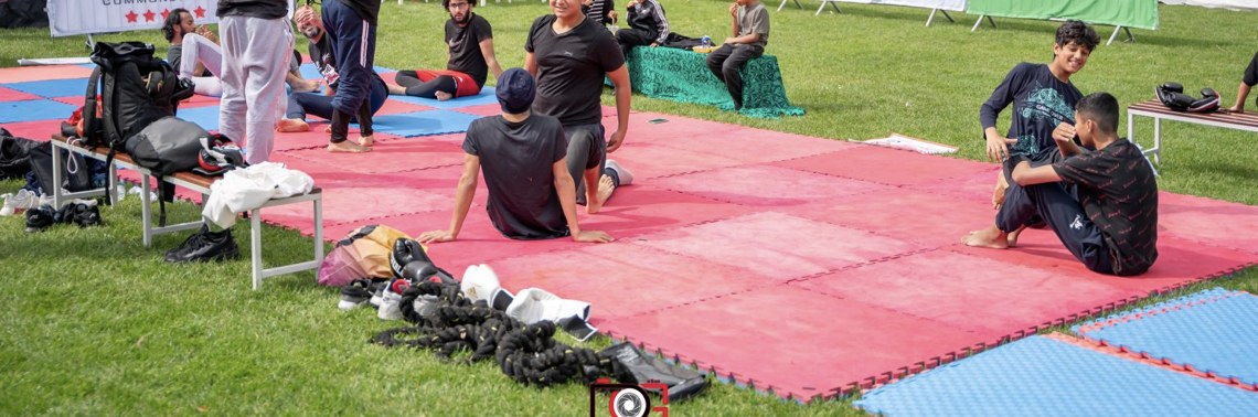 Open-air training session on mats at a community event