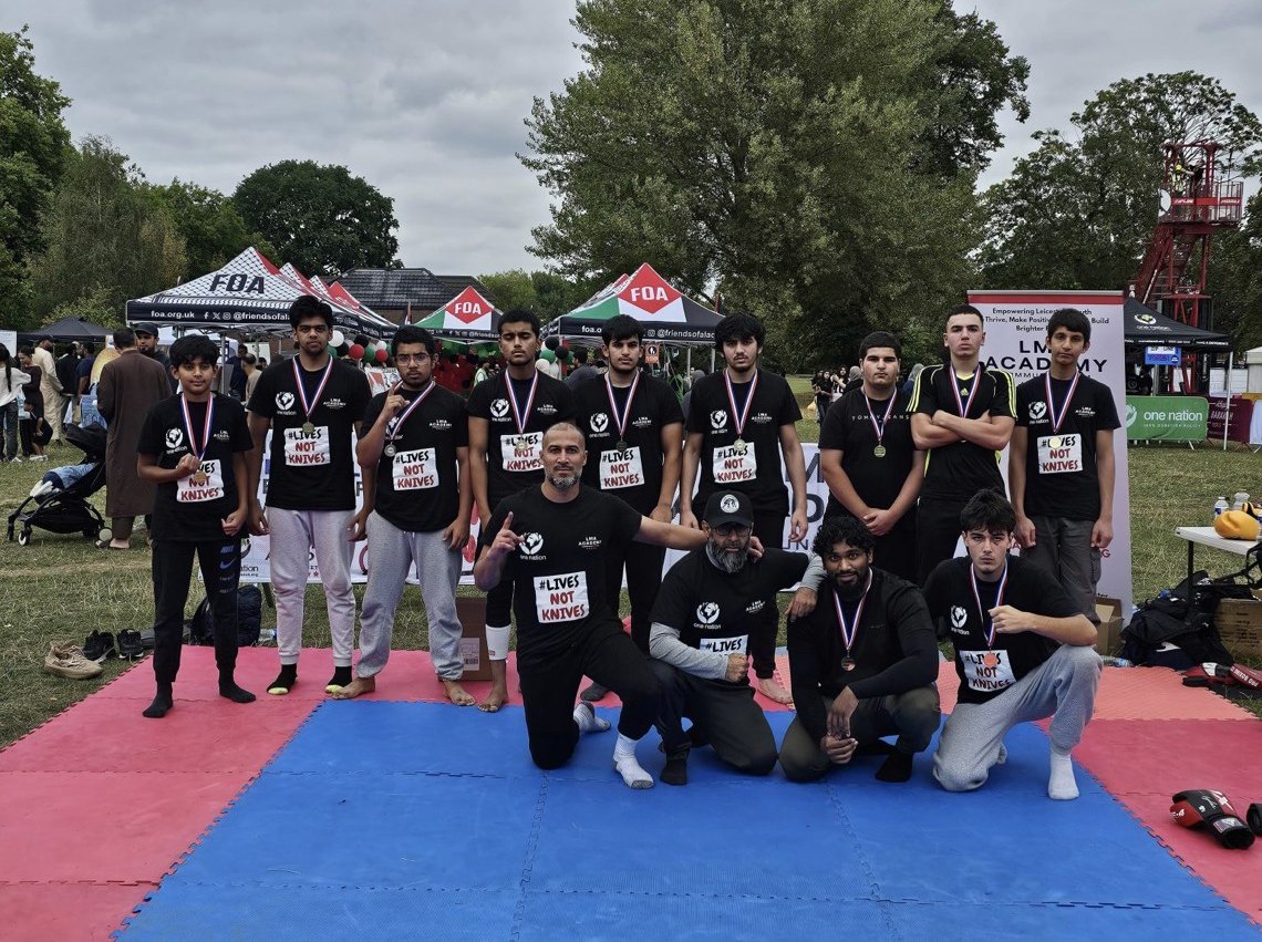 LMA Academy MMA and grappling team with medals at a community event